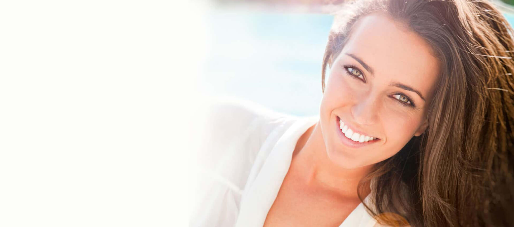 Smiling woman with healthy teeth and youthful appearance, showcasing the benefits of Botox® and dermal fillers at PGA Dentistry in Palm Beach Gardens.