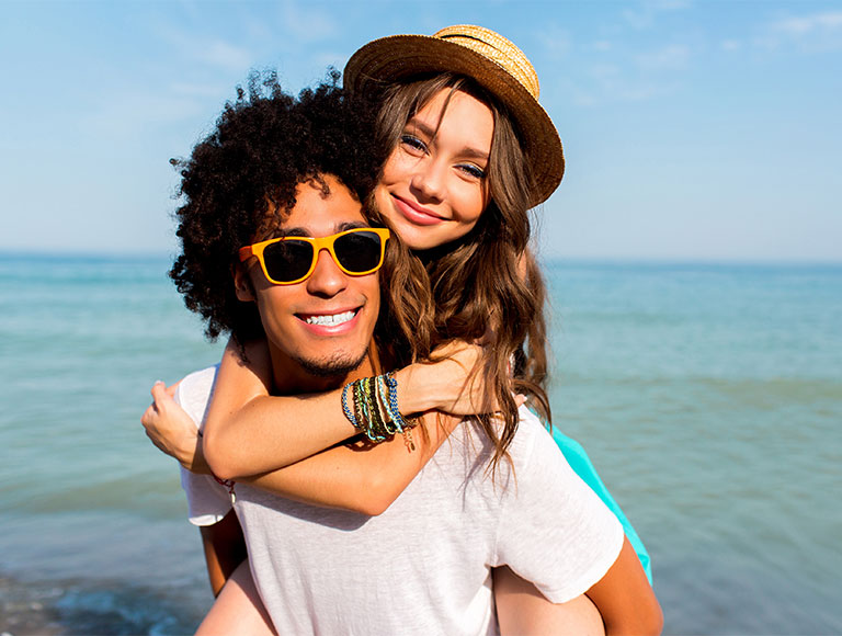 Couple smiling at the beach